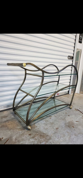 VINTAGE MID CENTURY MODERN HOLLYWOOD REGENCY DIA/ MILO BAUGHMAN SCULPTURAL METAL BRUSHED BRASS N GLASS SERVING/ TEA/ BAR CART ON CASTORS